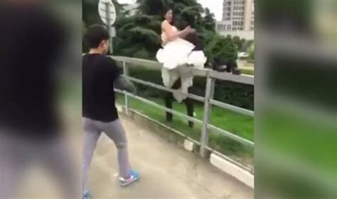 Bride Suffers Unfortunate Accident While Walking Along Metal Fence