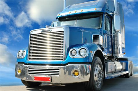 Blue Semi Truck Driving On A Road Stock Photo Download Image Now Istock