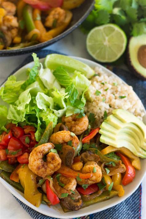 Sheet pan shrimp fajitas are a simple, healthy weeknight meal! One Pan Whole30 Shrimp Fajitas - Eat the Gains