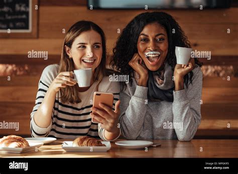 Two Women And Drinking Coffee Hi Res Stock Photography And Images Alamy