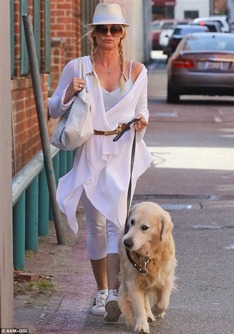 Nicollette Sheridan Opts For Glamour Over Practicality In An All White