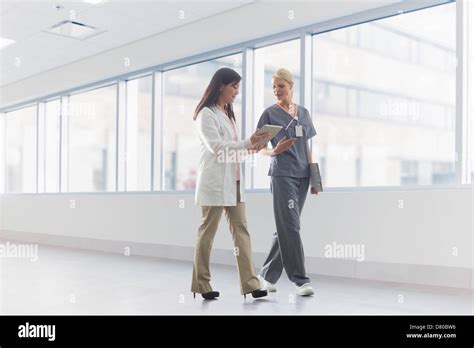 Doctor And Nurse Talking In Hospital Stock Photo Alamy
