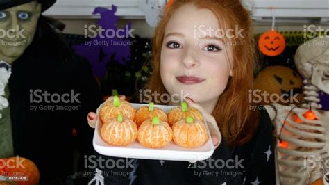 Image Of Halloween Themed Party Food Ideas Redhead Teenage Girl Holding