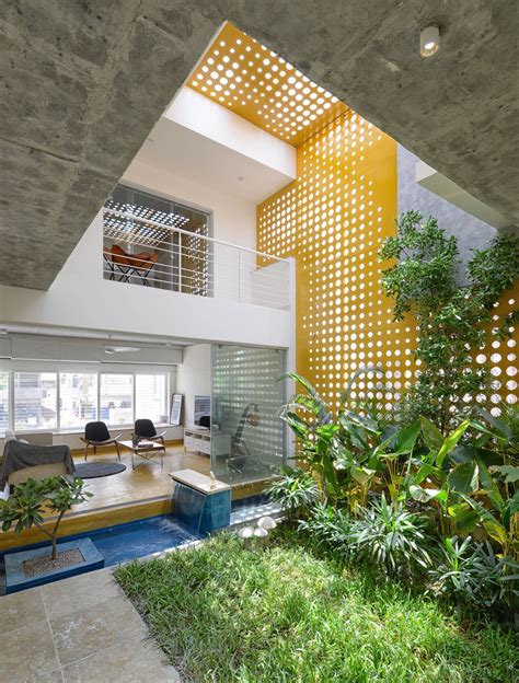 Double Height Living Spaces Around The Central Indoor Courtyard Garden