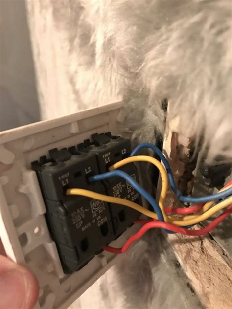 The proper way was to use double red t&e, but the cheaper way was to sleeve the black wire. Problems wiring 2 way 2 gang switches/dimmers | DIYnot Forums