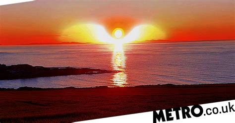 Angelic Sunset With Halo And Wings Captured By Amateur Photographer