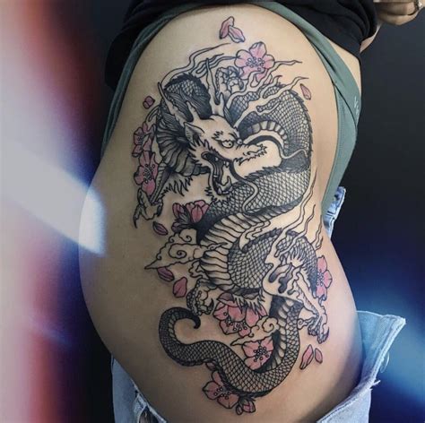 Japanese Dragon Tattoo With Pink Colored Sakuras And Clouds On The Hip Side Tattoo Girls Small