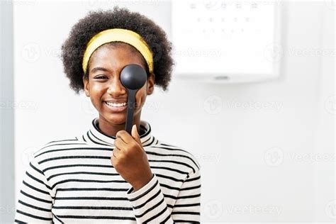 Smiling Young Woman African American Doing Eye Test In Ophthalmological