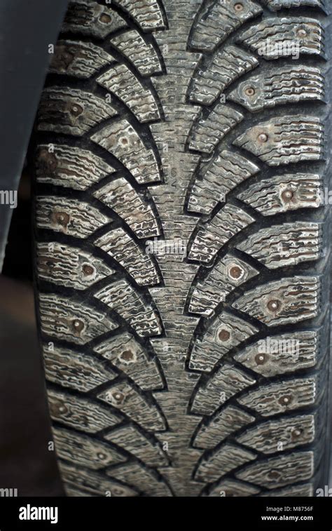 Worn Dirty Tread Of Winter Studded Car Tire Stock Photo Alamy
