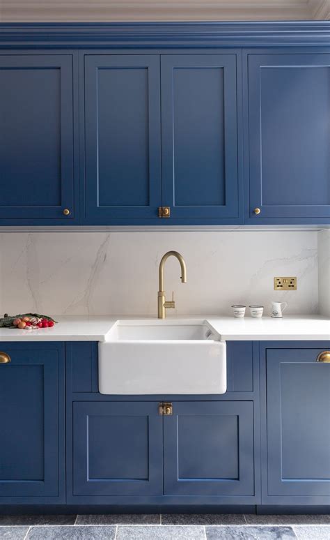 A belfast kitchen sink is a great way to add a traditional touch to your kitchen. Blue Shaker Kitchen with Belfast Sink and Gold Tap, # ...