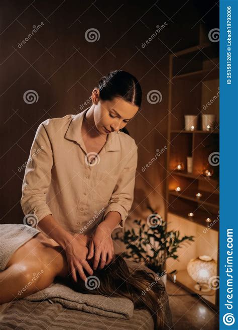 A Masseuse Gives A Head Massage To A Woman At The Spa A Professional Masseur Massages The Head
