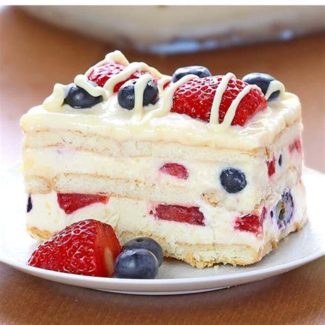 This yellow cake is frosted with whipped topping and decorated with blueberries and strawberries for the stars and stripes on the american flag. 15 Red, White And Blue Desserts For The Fourth Of July (Part 1) - Style Motivation