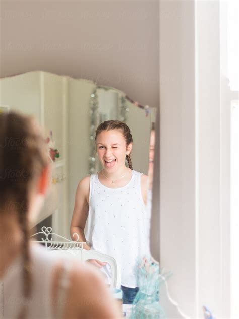 Teen Girl Looking At Her Reflection In The Mirror Porgillian Vann