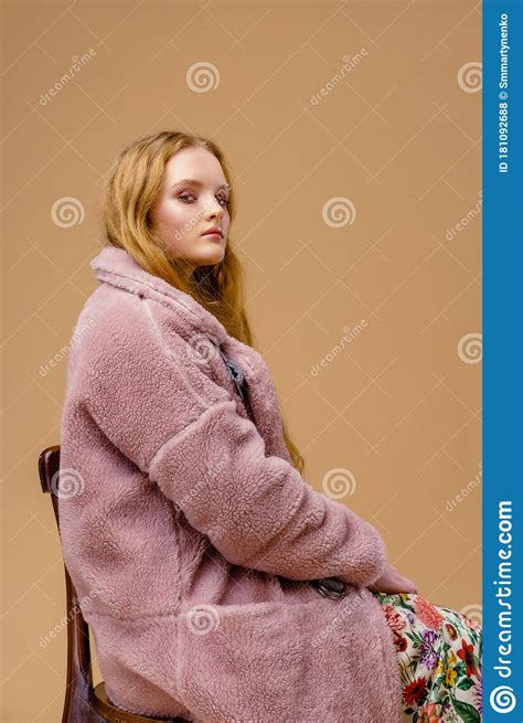 Full Length Portrait Of Gorgeous Young Fashion Model Posing On Studio