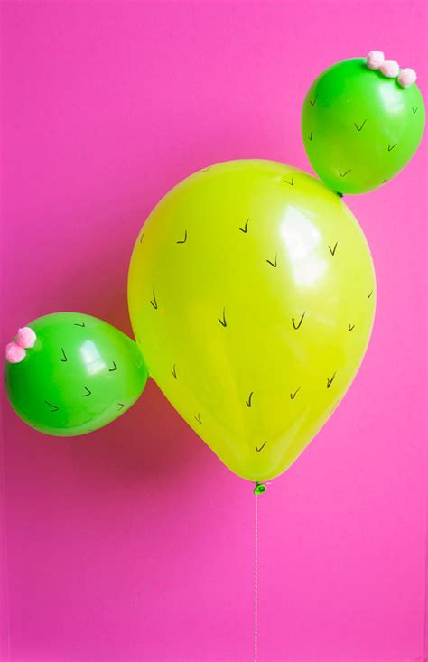 In the cactus fiesta party that we put together, we made some fun cactus shaped balloons as decoration. Cactus Balloons! | Design Improvised
