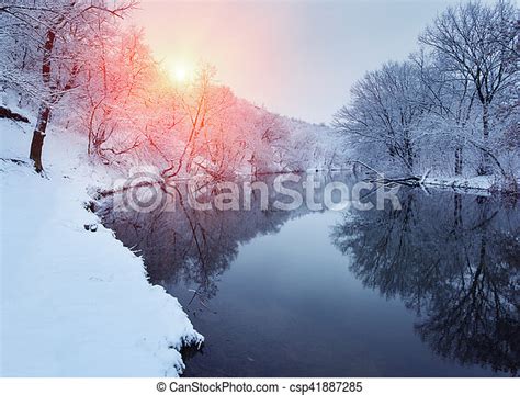 Colorful Landscape With Snowy Trees Beautiful Frozen River At Sunset