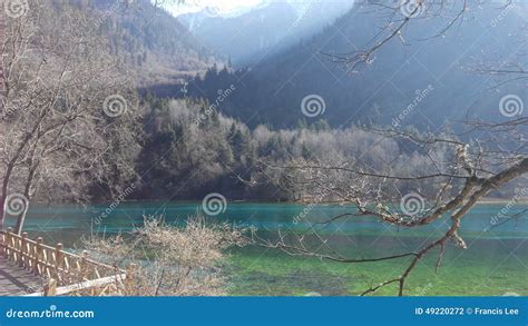 Clear View Of Blue Crisp Water Of Beautiful Lake With Mountain Scene