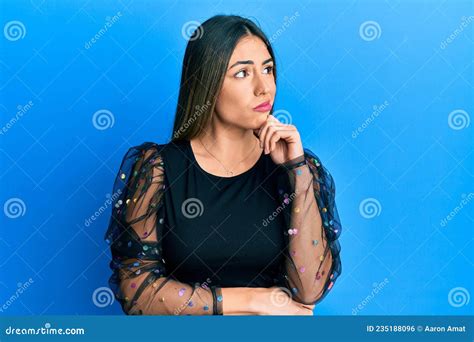 Young Hispanic Woman Wearing Casual Clothes Serious Face Thinking About