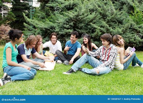 Group Of Students Sitting In Park Stock Image Image Of Beautiful