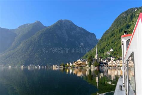 View Of Hallstatt Lakeside Village With Mountains Reflected On L Stock