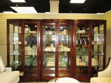 Precious crystal and glassware sparkles and shines when displayed in a lighted curio cabinet; Thomasville Curio Cabinet at The Missing Piece