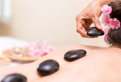 Spa Therapist Is Placing Hot Stone On Back Stock Image Image Of Pretty Therapy 96704267