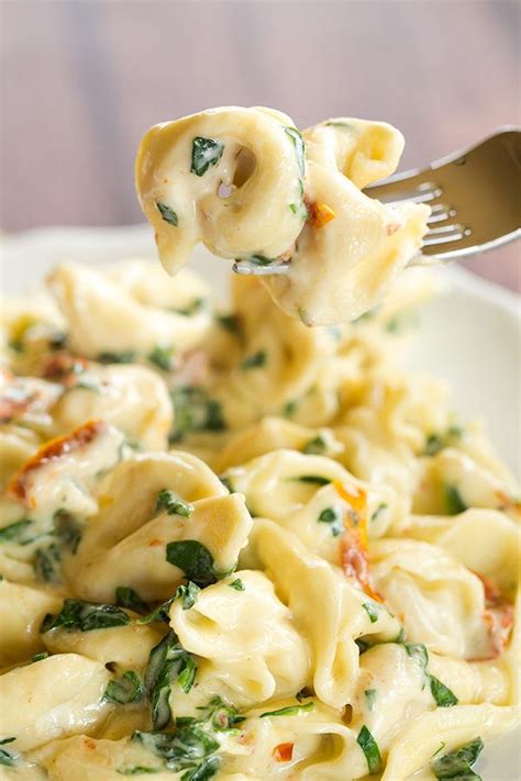 Tortellini In Parmesan Cream Sauce With Spinach And Sun Dried Tomatoes