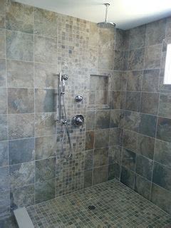 Once that lining is in place, you can start tiling. Same tiles on bathroom floor and shower wall