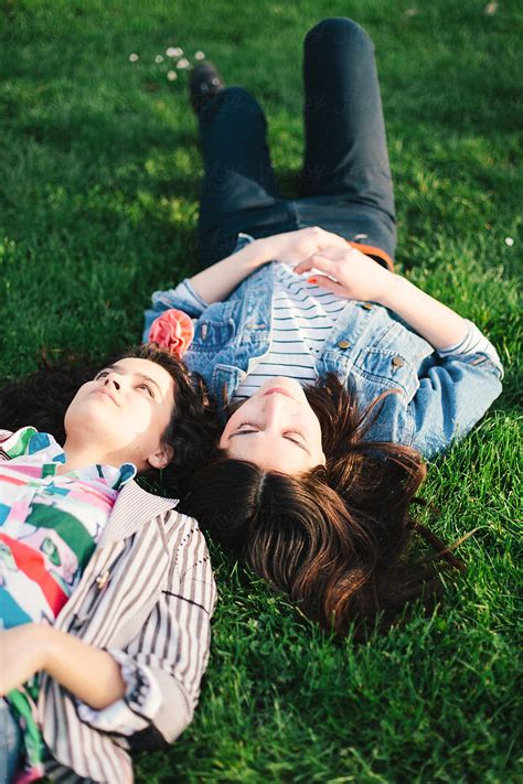 Two Female Friends Having A Good Time In A Park By Stocksy Contributor Mak Stocksy