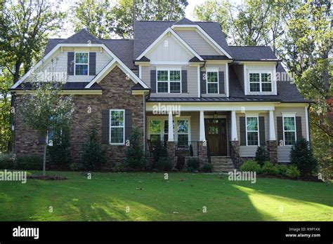 Front exterior of a two-story suburban home in a neighborhood in North
