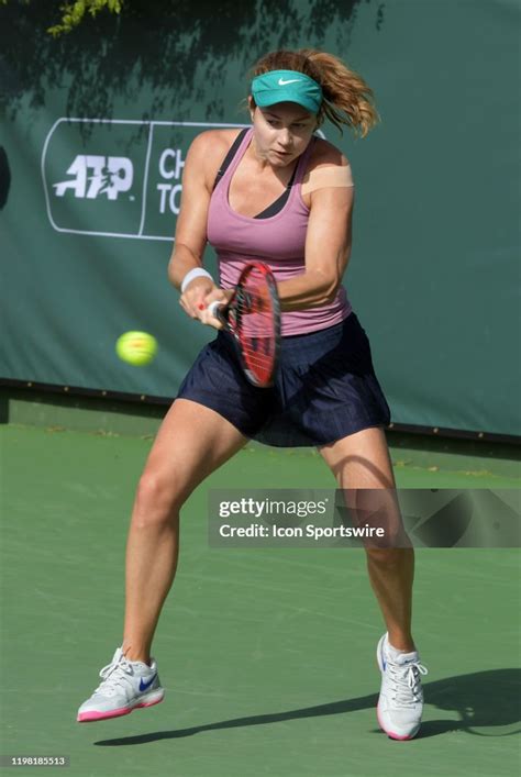 Wta Tennis Player Stefanie Voegele Returns The Ball In A Finals Match