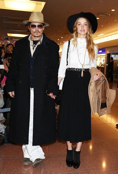 Amber Heard and Johnny Depp Airport Style - Johnny Depp and Amber Heard