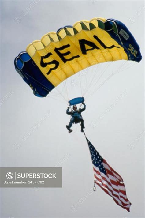 Low Angle View Of A Man Parachuting Superstock
