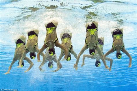 Underwater Photographs Show Synchronised Swimmers Competing At European