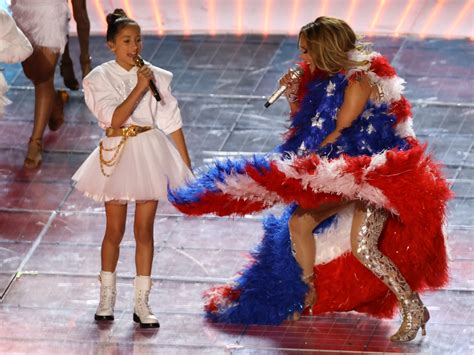 Citizens jennifer lopez and her daughter, emme maribel muniz, perform while a puerto rican flag is displayed during the super bowl halftime show at hard rock stadium in miami on sunday, feb. Jennifer Lopez wore a reversible cape that looked like the American and Puerto Rican flags ...
