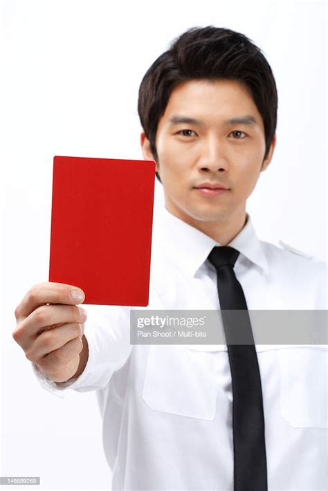 Businessman Holding Red Card High Res Stock Photo Getty Images