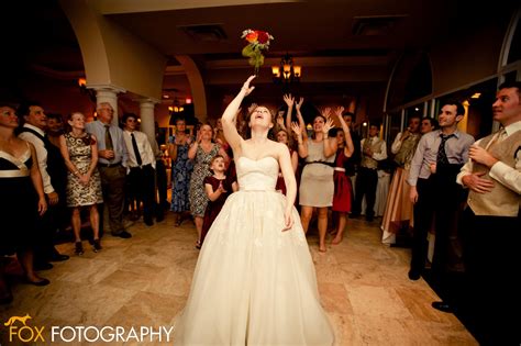 a marriage of passion and style wedding traditions bouquet toss