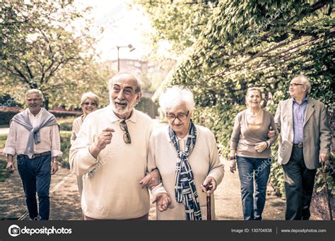 Smiling Old People Walking — Stock Photo © Oneinchpunch 130704938