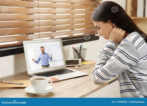 Young Woman Watching Video At Desk Online Learning Stock Photo Image