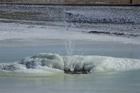Formation Of An Ice Geyser Ice Volcano In Apartment Complex Pond