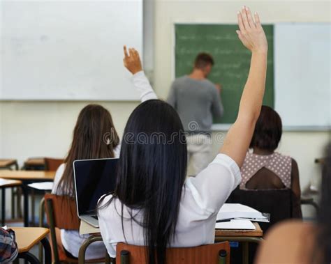 I Have A Questiona Female Student Raising Her Hand To Ask A Question