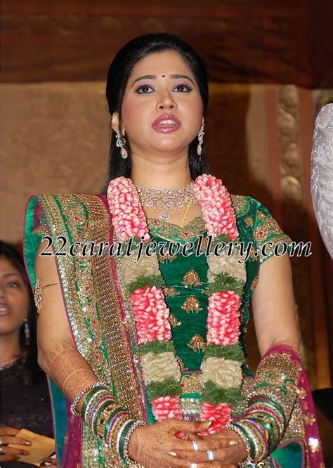 jayam ravi wife aarthi in diamond necklace and armlet jewellery designs