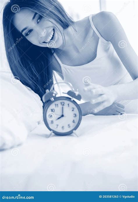 Girl Waking Up At Bedroom With Alarm Clock Stock Image Image Of Hispanic Alarmclock 203581263