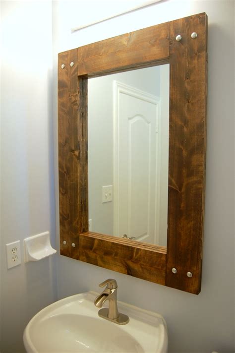 When we moved into our current home, there was a plain old mirror hung on i loooooovethis wood. How To Build And Decorate With Rustic Mirror Frames