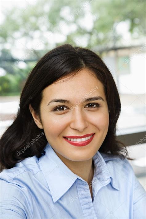 Hispanic Woman Smiling — Stock Photo © Iofoto 9255405