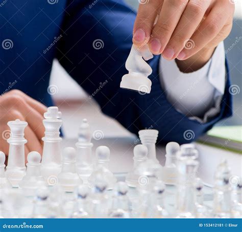 Young Businessman Playing Glass Chess In Office Stock Image Image Of