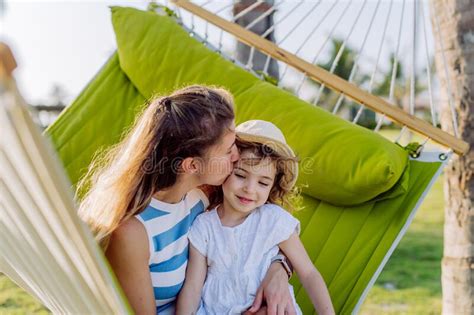 Mother With Her Daughter Enjoying Holiday In Exotic Country Lying In Hammock Stock Image