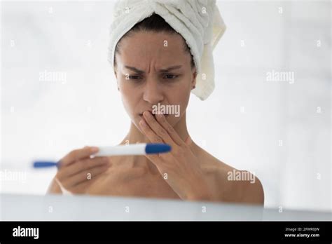 Shocked Upset Young Woman Checking Pregnancy Test Result Stock Photo