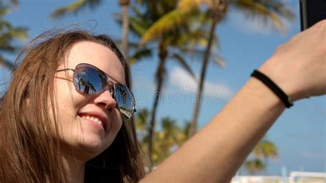 Young Woman Taking A Selfie Under Palm Trees At The Beach Stock Image Image Of Glamor Nature