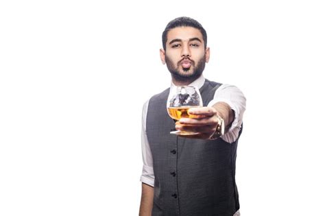Premium Photo Handsome Bearded Businessman Holding A Glass Of Whiskey